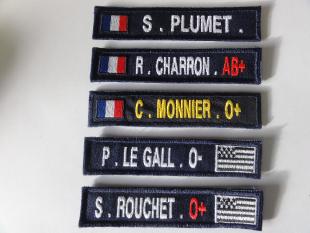 Name tape with embroidered flag